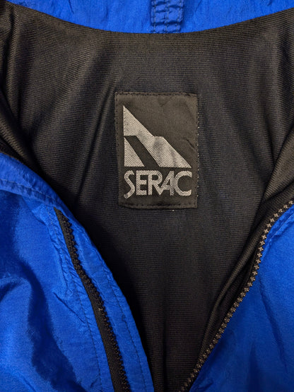 Vintage sport trui met schoudervullingen. Blauw Zwart gekleurd. Maat L.