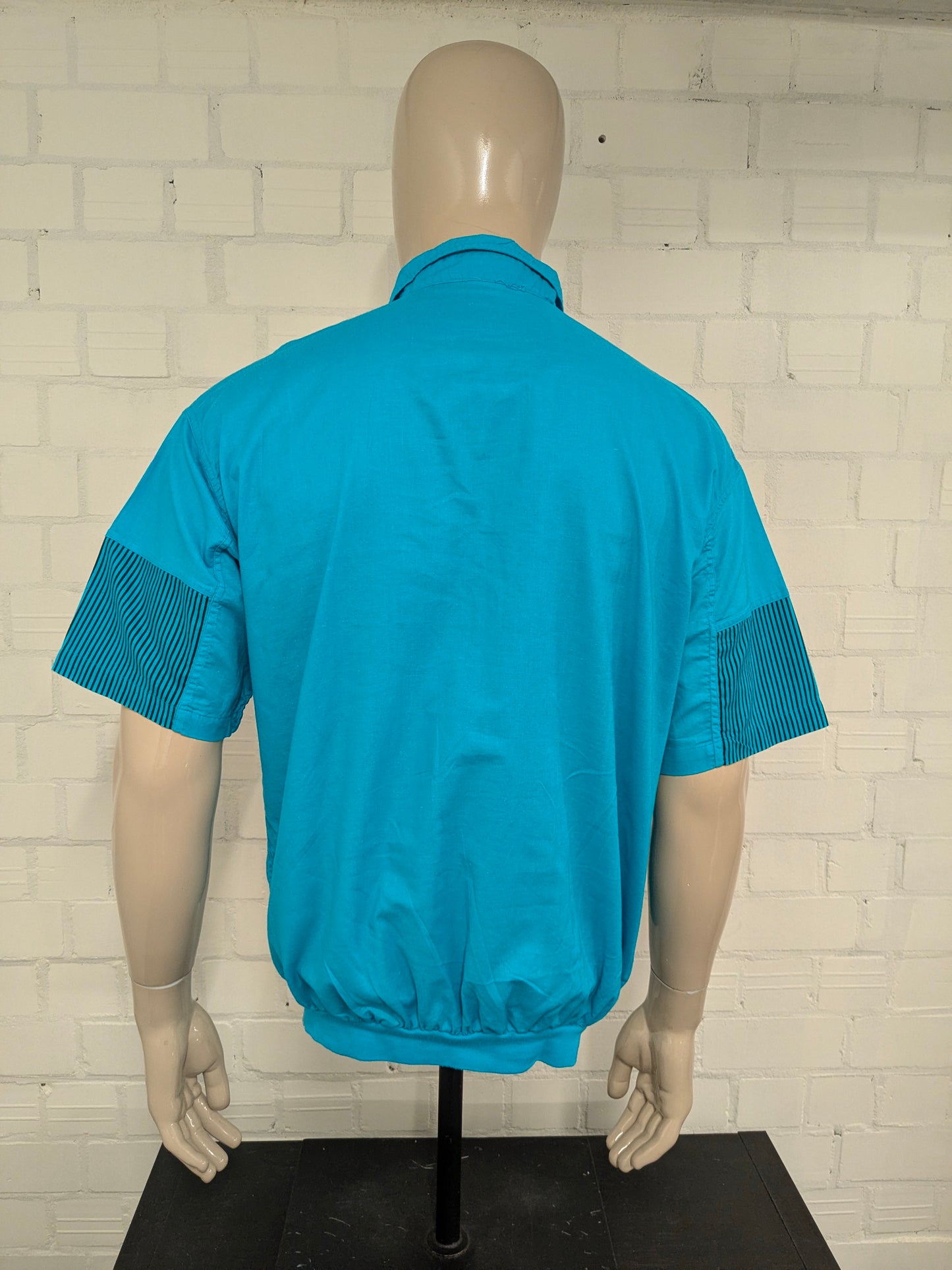 Vintage Street Rag Polo mit elastischem Band. Blau mit Aufdruck. Größe XL.