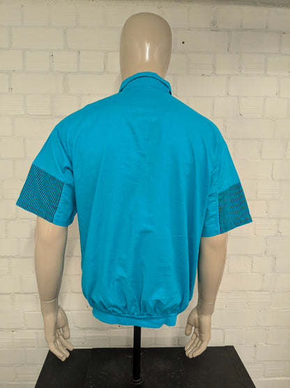 Vintage Street Rag Polo mit elastischem Band. Blau mit Aufdruck. Größe XL.