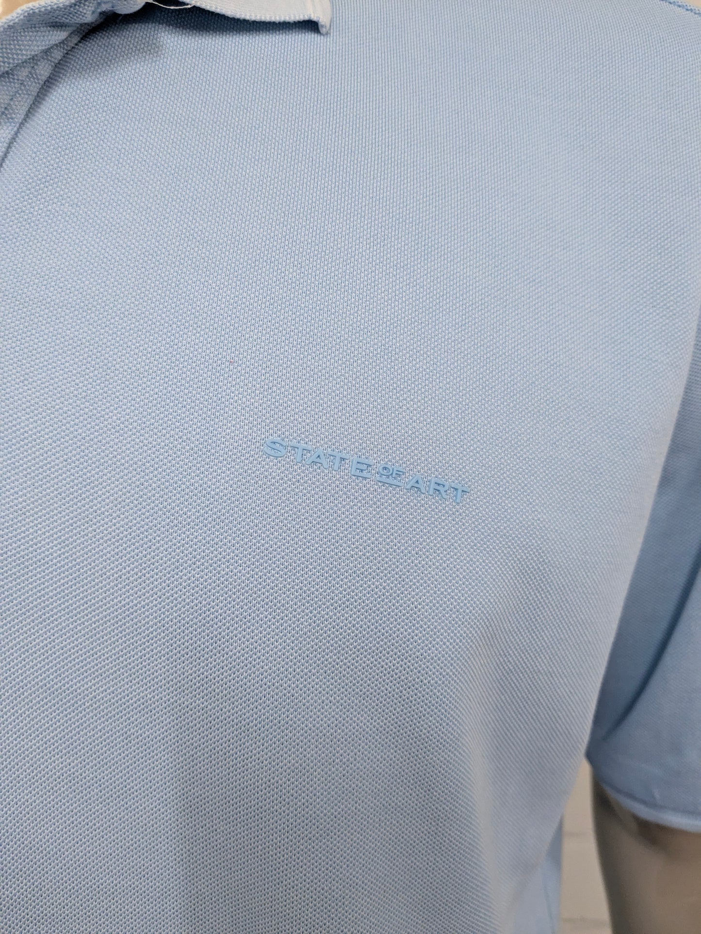 State of Art polo. Licht Blauw gekleurd. Maat 2XL / XXL.