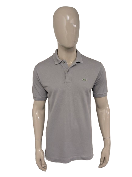 Lacoste Polo. Grijs gekleurd. Maat M.