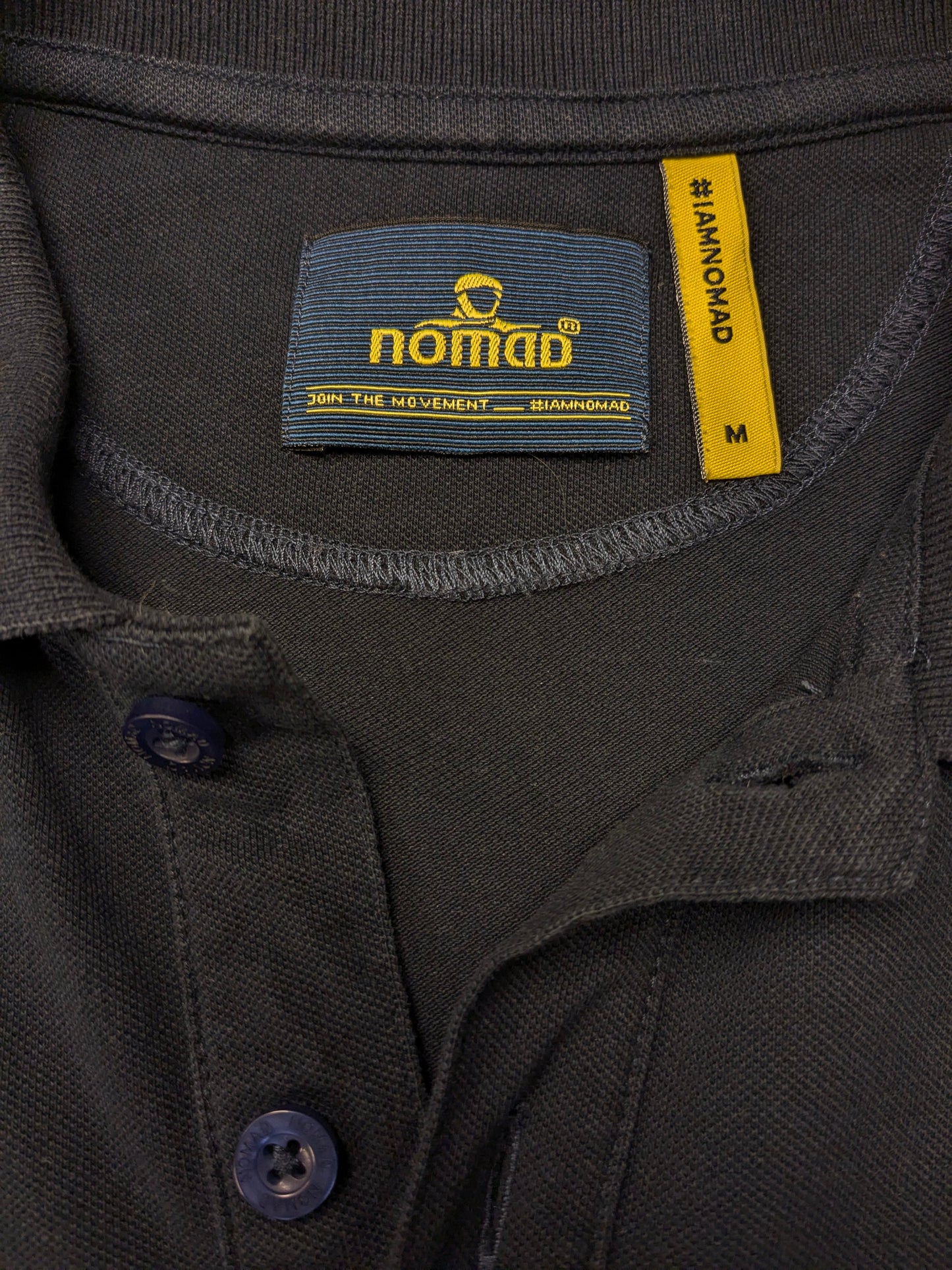 Nomad polo. Donker Blauw gekleurd. Maat M.
