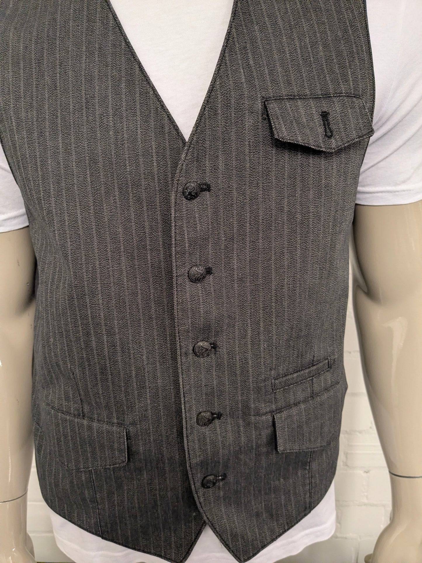 It's gilet. Licht / Donker Grijs gestreept. Maat M.