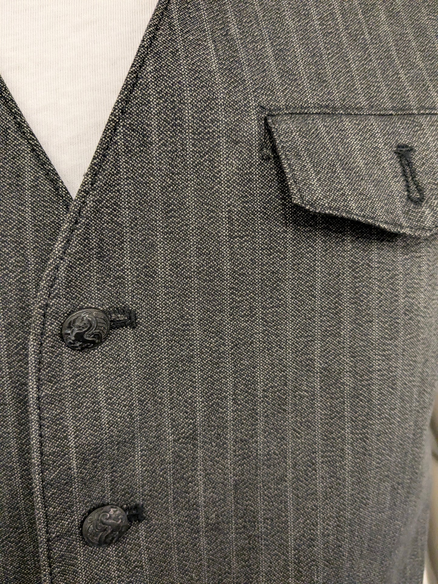 It's gilet. Licht / Donker Grijs gestreept. Maat M.