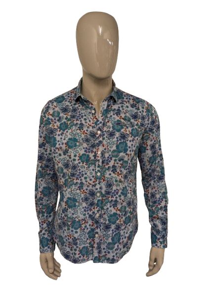 Camiseta NZA Nueva Zelanda Auckland. Estampado floral azul verde rojo. Talla L.