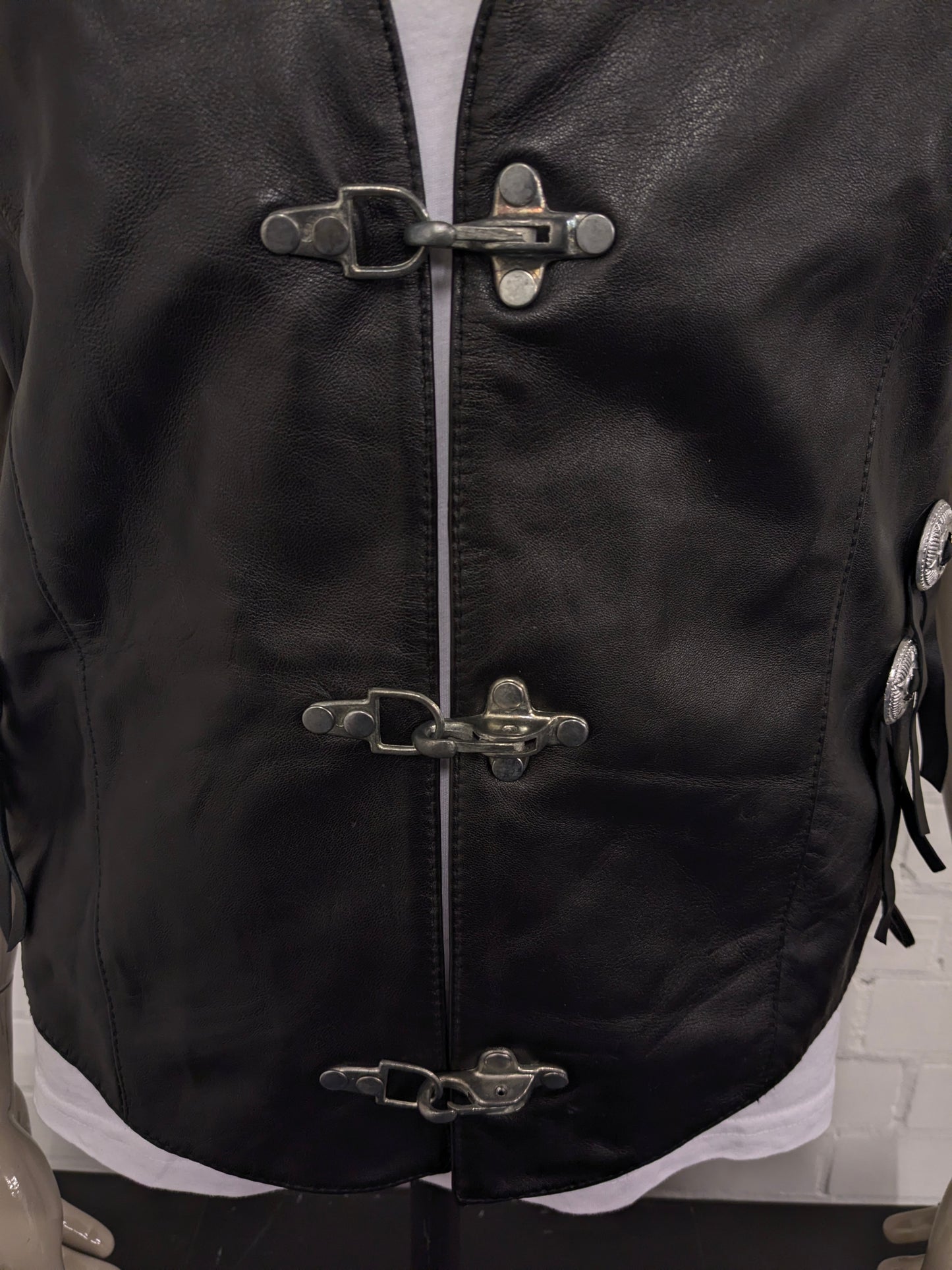 Highway1 double-sided leather waistcoat with buckle and leather lace details. Colored black. Size L.