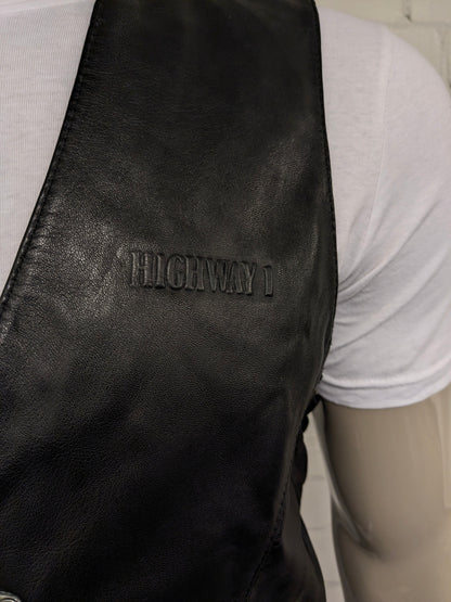 Highway1 double-sided leather waistcoat with buckle and leather lace details. Colored black. Size L.