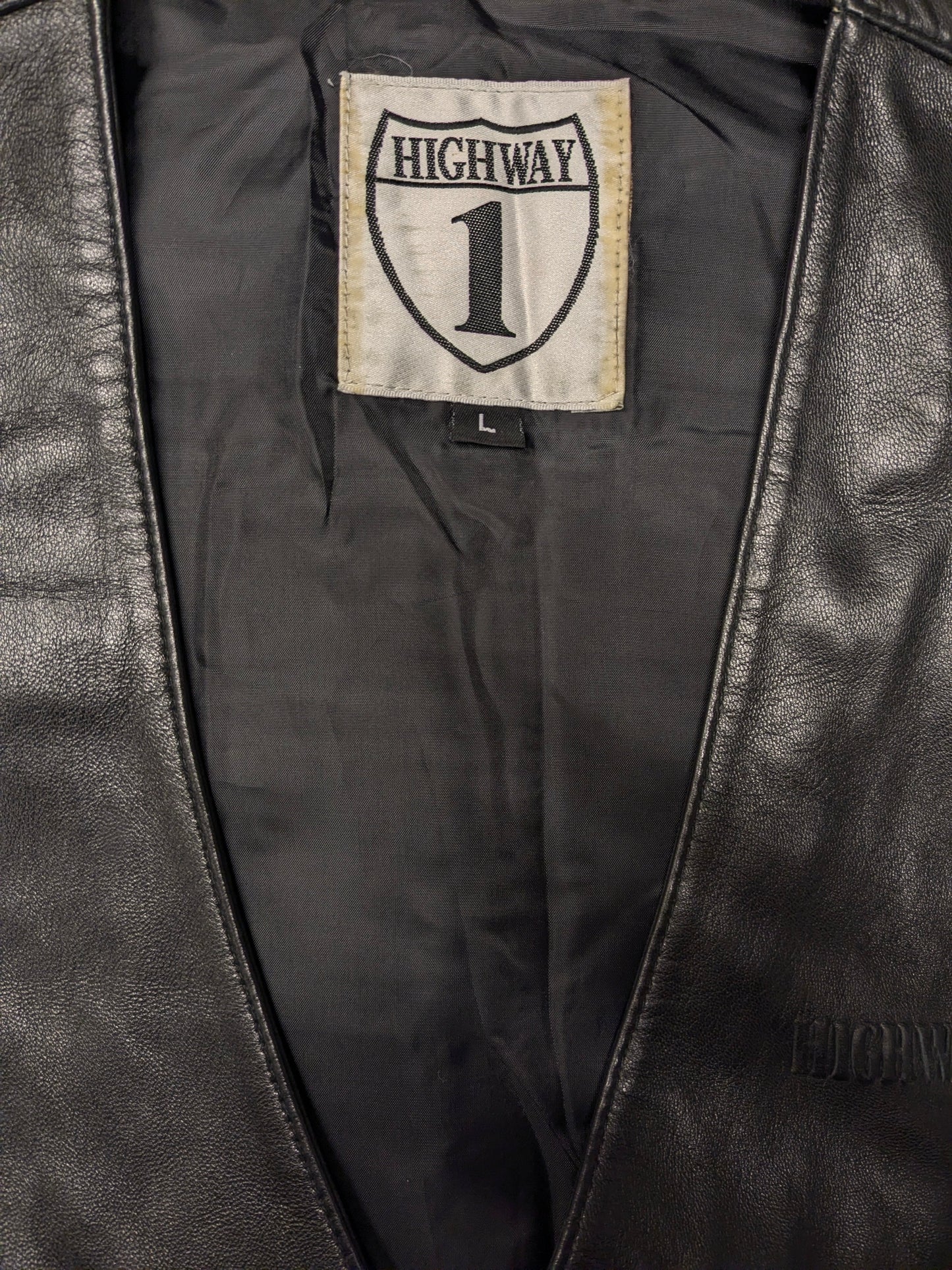 Highway1 double-sided leather waistcoat with buckle and leather lace details. Colored black. Size L.