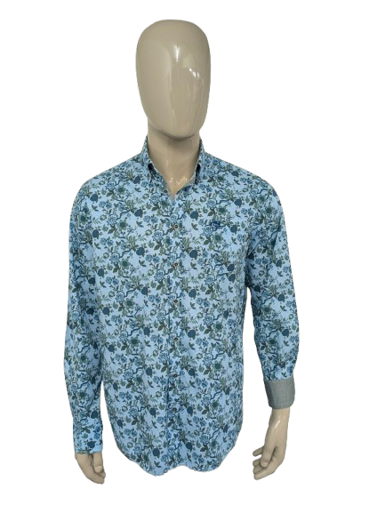 Camiseta de última generación. Estampado floral azul verde. Talla L. Ajuste regular.