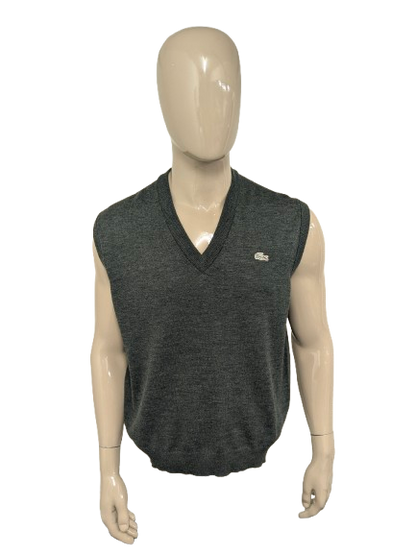 Vintage Lacoste Wollen spencer met V-Hals. Donker Grijs gemêleerd. Maat 2XL / XL. Limited Edition.