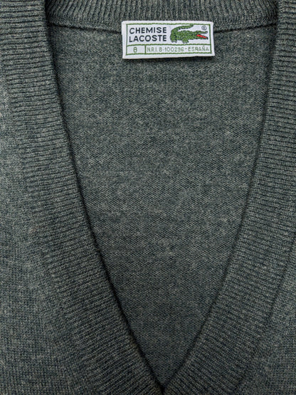 Vintage Lacoste Wollen spencer met V-Hals. Donker Grijs gemêleerd. Maat 2XL / XL. Limited Edition.
