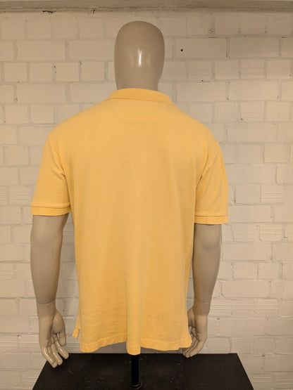 Nautica polo. Geel gekleurd. Maat L.