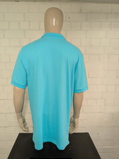 Izod polo. Blauw gestreept motief. Lang model! Maat XL.
