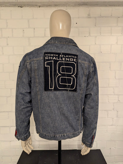 Gaastra spijker jack. Blauw gemêleerd met emblemen. Maat L.