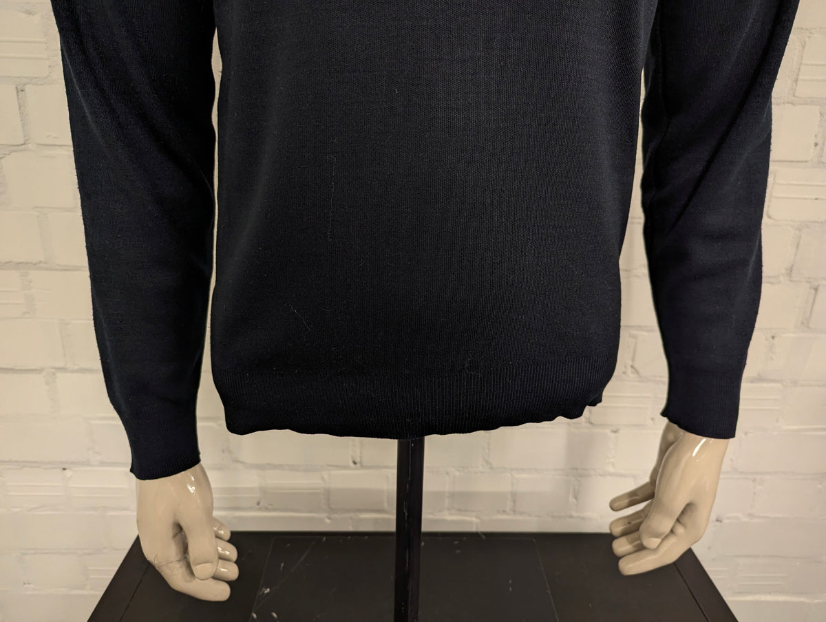 Tommy Hilfiger Wollen trui met V-Hals. Donker Blauw gekleurd. Maat M. 100% Wol.