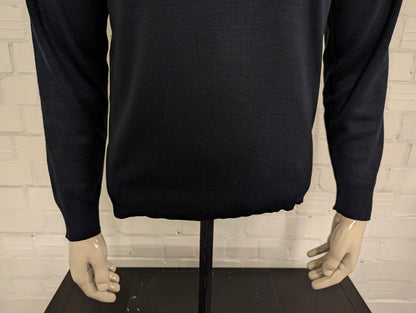 Tommy Hilfiger Wollen trui met V-Hals. Donker Blauw gekleurd. Maat M. 100% Wol.