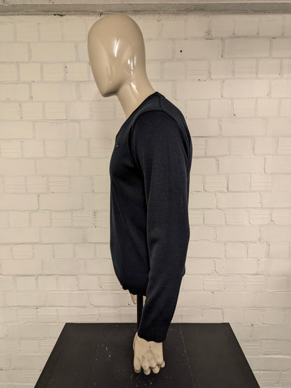 Tommy Hilfiger Wollen trui met V-Hals. Donker Blauw gekleurd. Maat M. 100% Wol.
