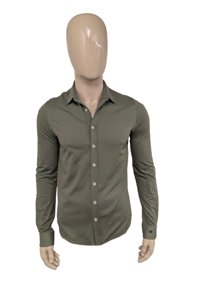 Camicia in ghisa. Colorato di verde. Taglia M.