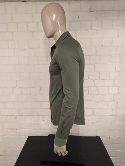 Camicia in ghisa. Colorato di verde. Taglia M.