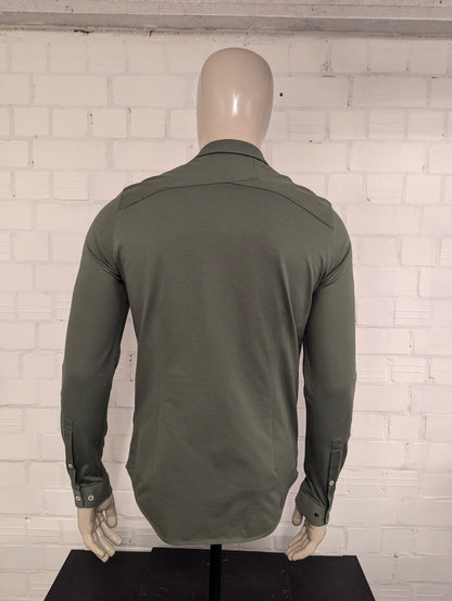 Camicia in ghisa. Colorato di verde. Taglia M.
