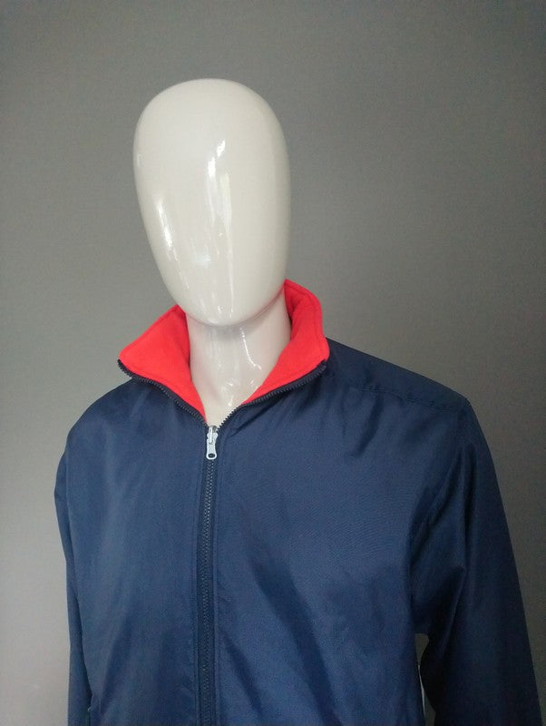Jacket réversible Rucanor / entre la veste. Bleu rouge ou foncé. Taille S