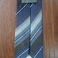 Cravate de soie Mexx. Bleu / gris rayé.