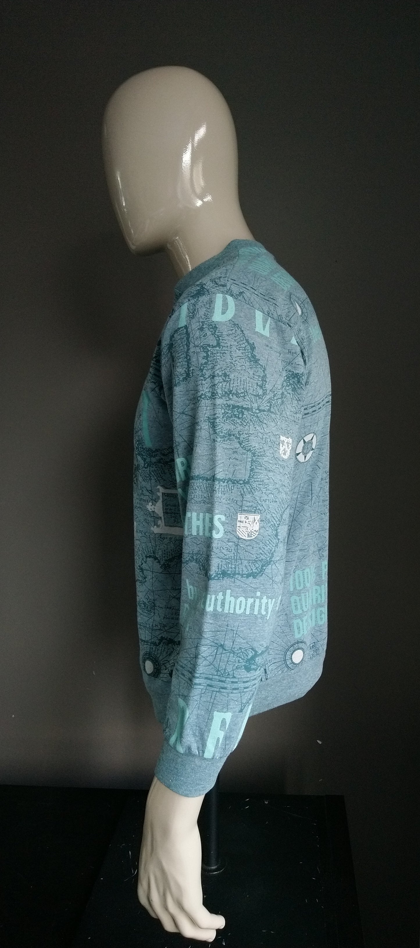 Vintage -Pullover mit Knöpfen. Grüner Druck. Größe M.