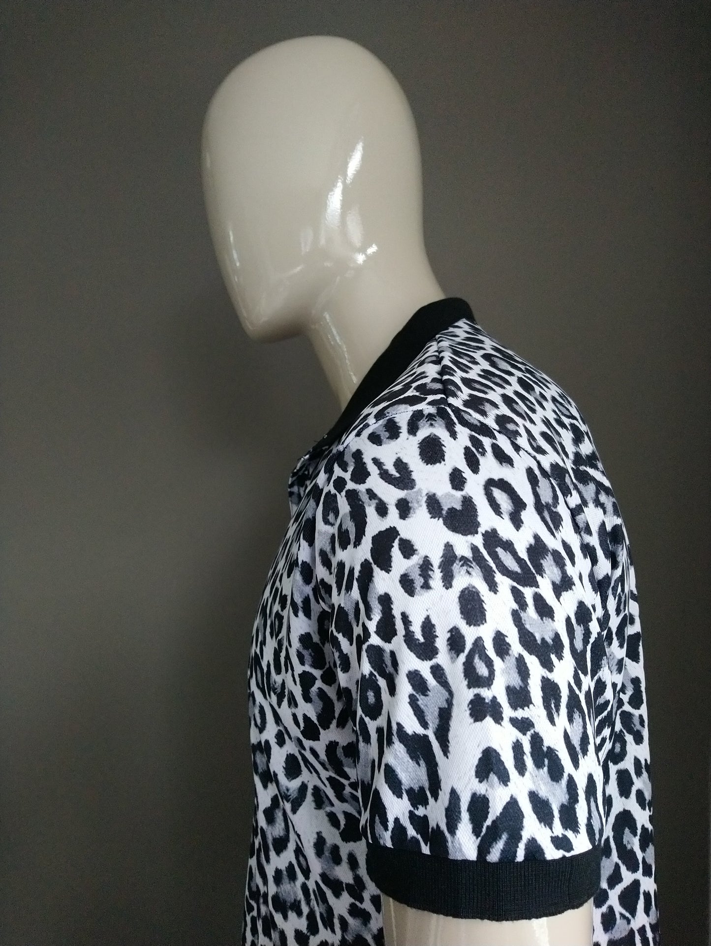 Polo with Animal Print. Gray black and white colored. Size XL.