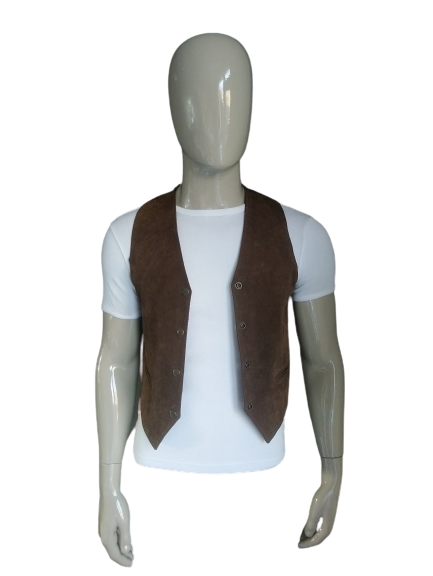 Leather waistcoat of swine leather with press studs. Brown colored. Size M.