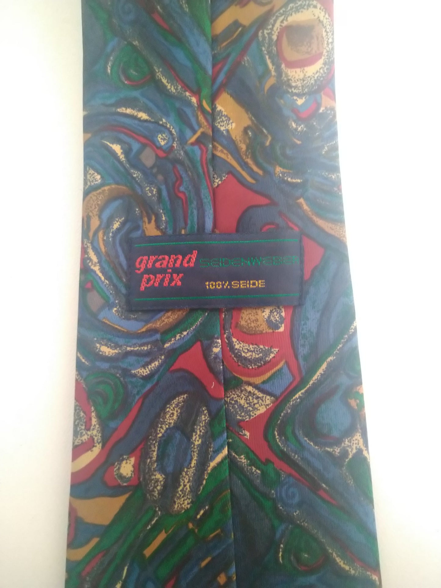 Vintage Grand Prix stropdas. Rood blauw groen motief. Zijde