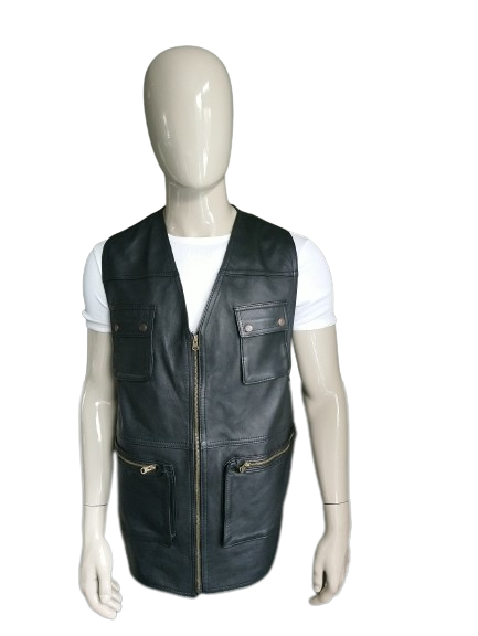 Leather body warmer with bags and zipper. Black colored. Leather back. Size L.