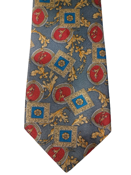 Cravatta vintage di Mosart Milano. Grigio con un bel motivo giallo, blu, rosso.