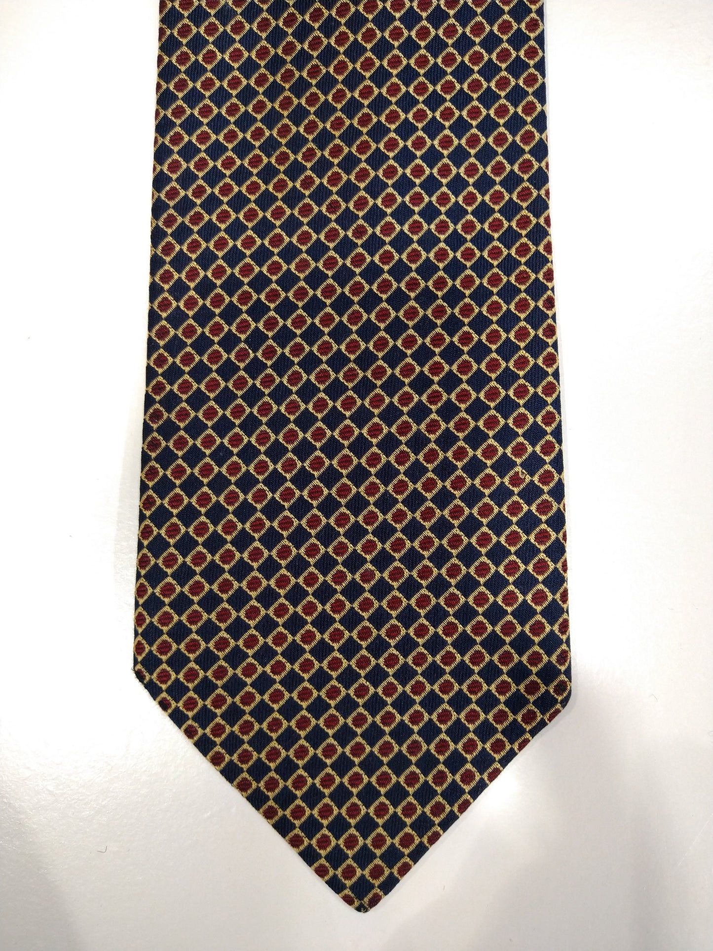 Cravate en soie vintage. Bleu avec motif de boules or / rouge.