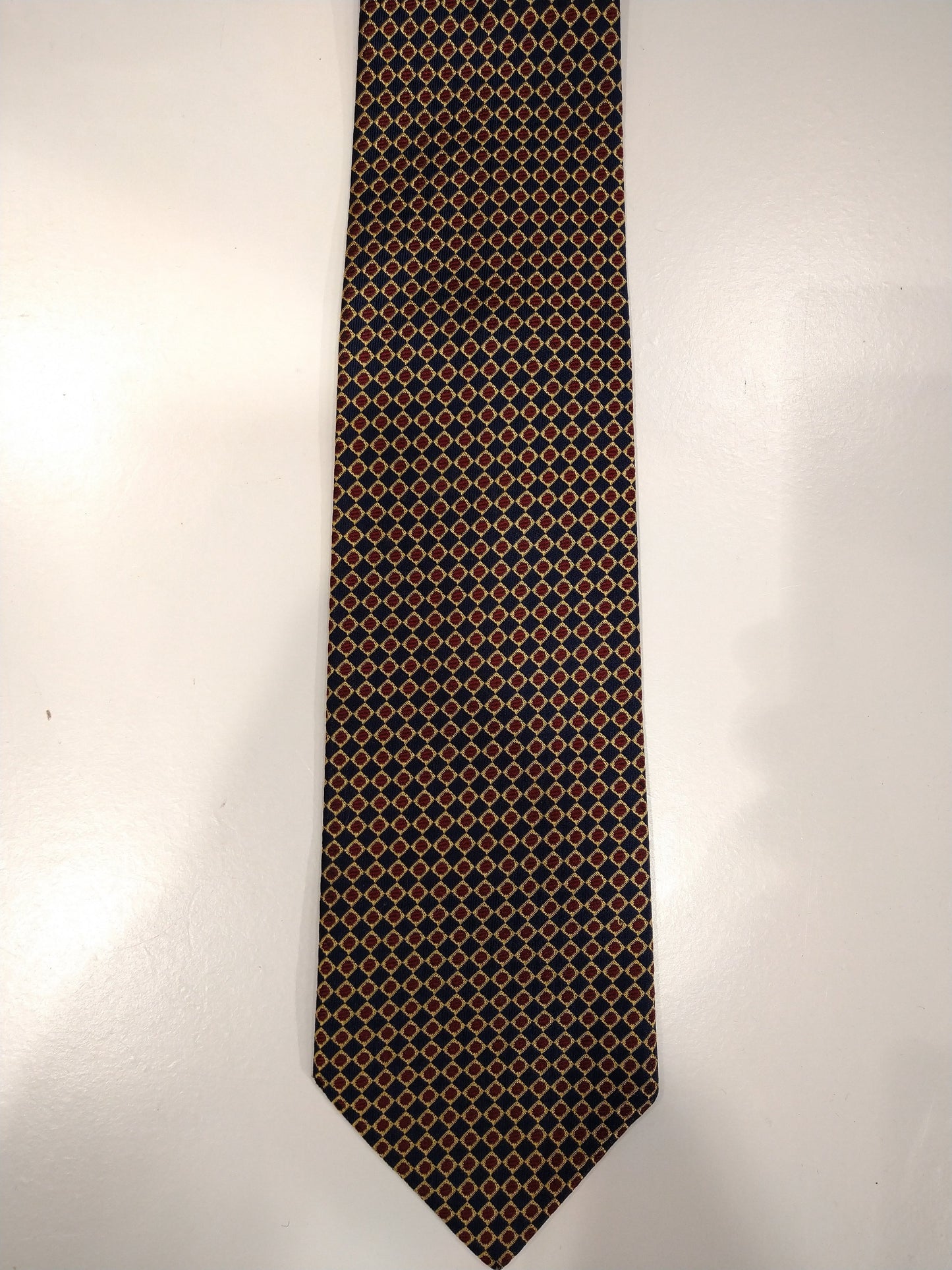 Vintage zijde stropdas. Blauw met goud / rood bolletjes motief.