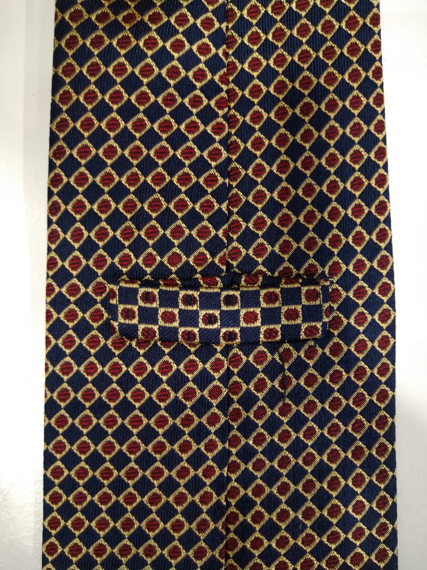Corbata de seda vintage. Azul con bolas de oro / rojo motivo.