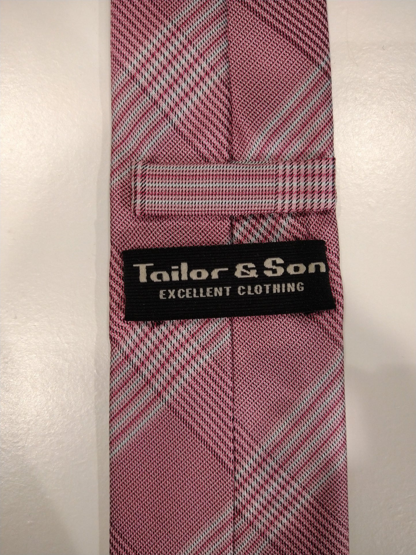 Cravatta di seta sartoriale e figlio. Motivo rosa.