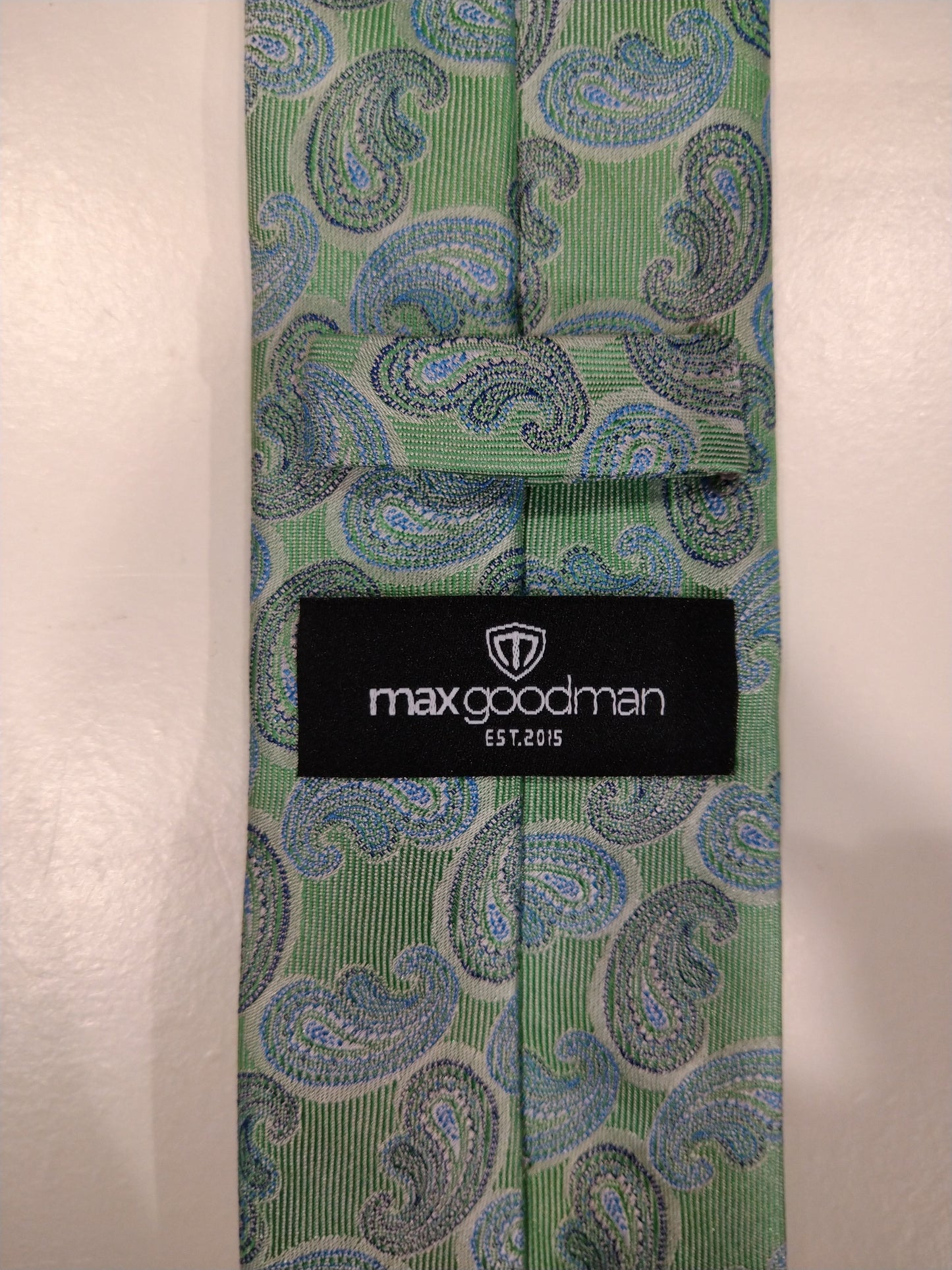Max Goodman zijde stropdas. Blauw groen motief.