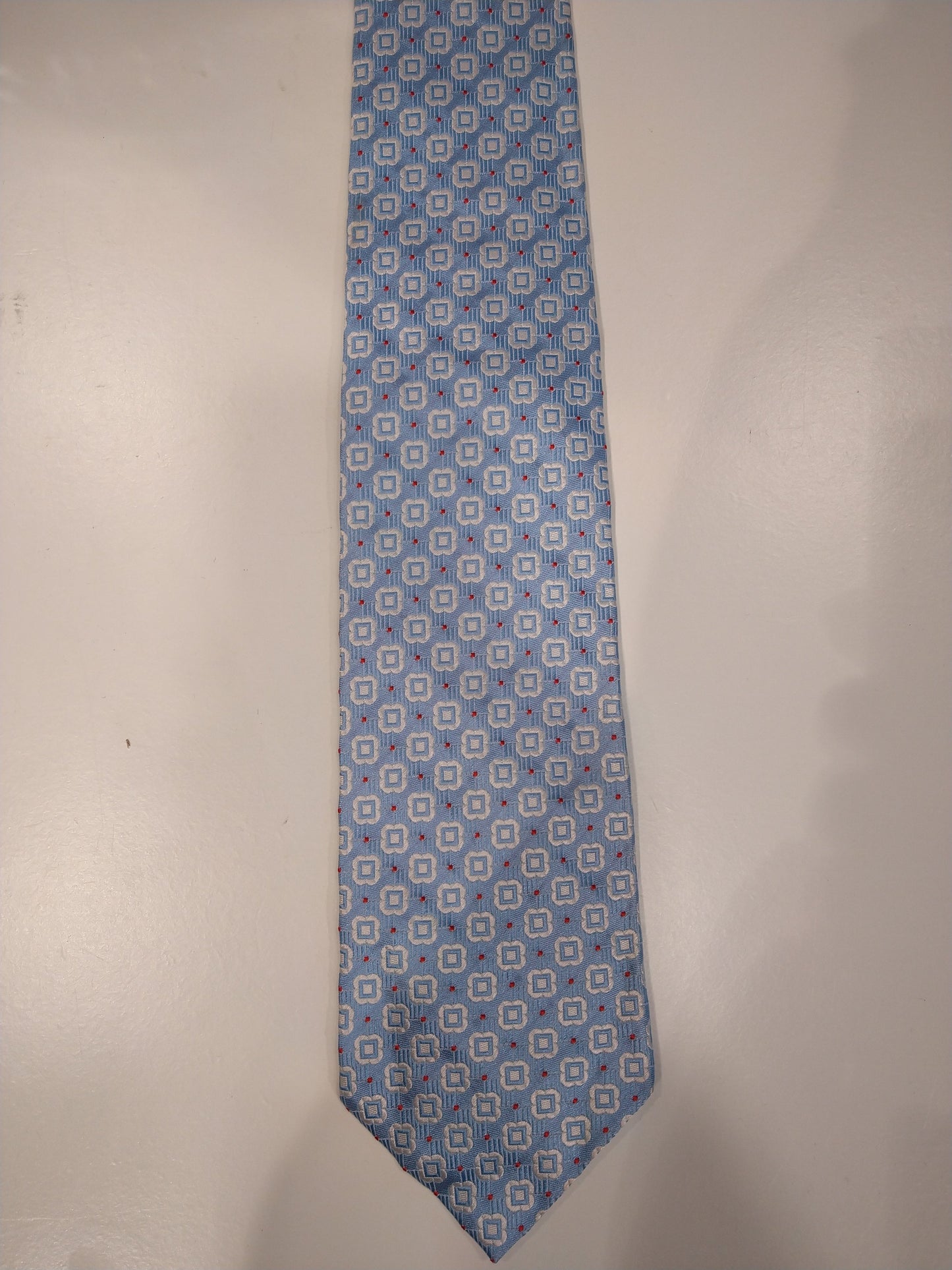 John Edward silk tie. Blue white motif.
