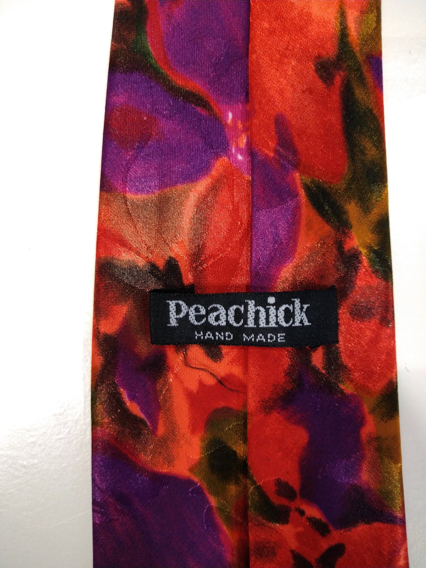 Peachick hand made polyester tie. Beautiful floral motif with separate metallic shine.