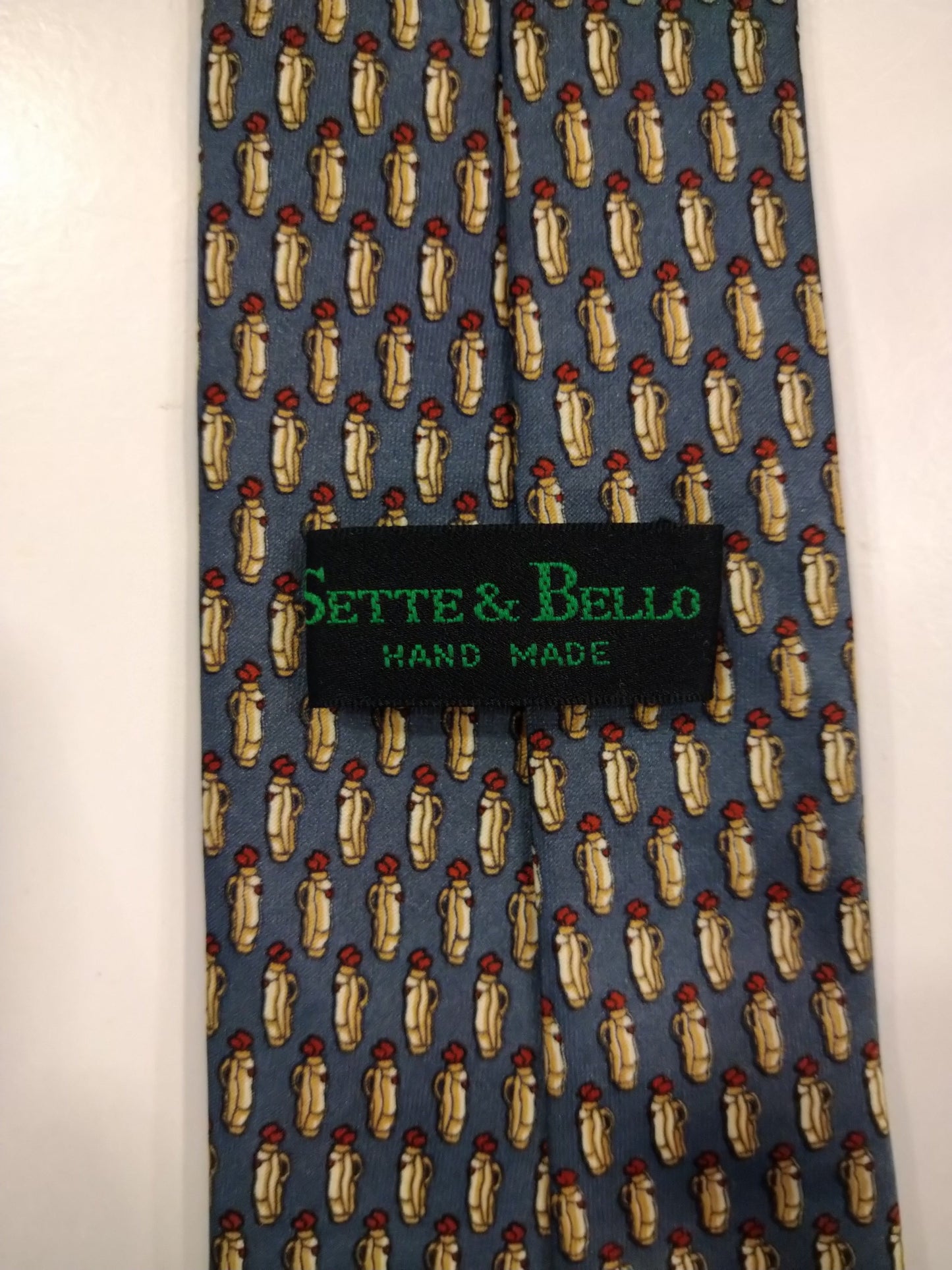 Sette & Belle Hand made silk tie. Gray yellow motif.