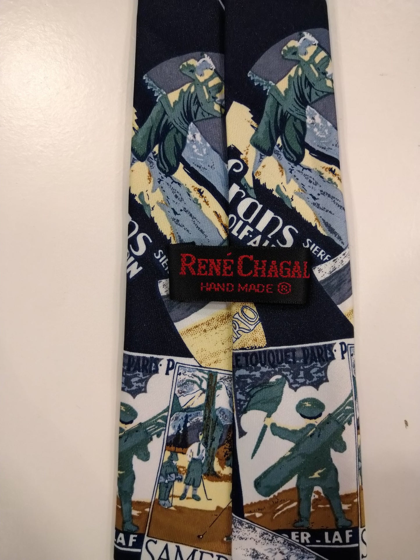 René Chagal hand made zijde stropdas. Prachtig blauw reis / wereld motief