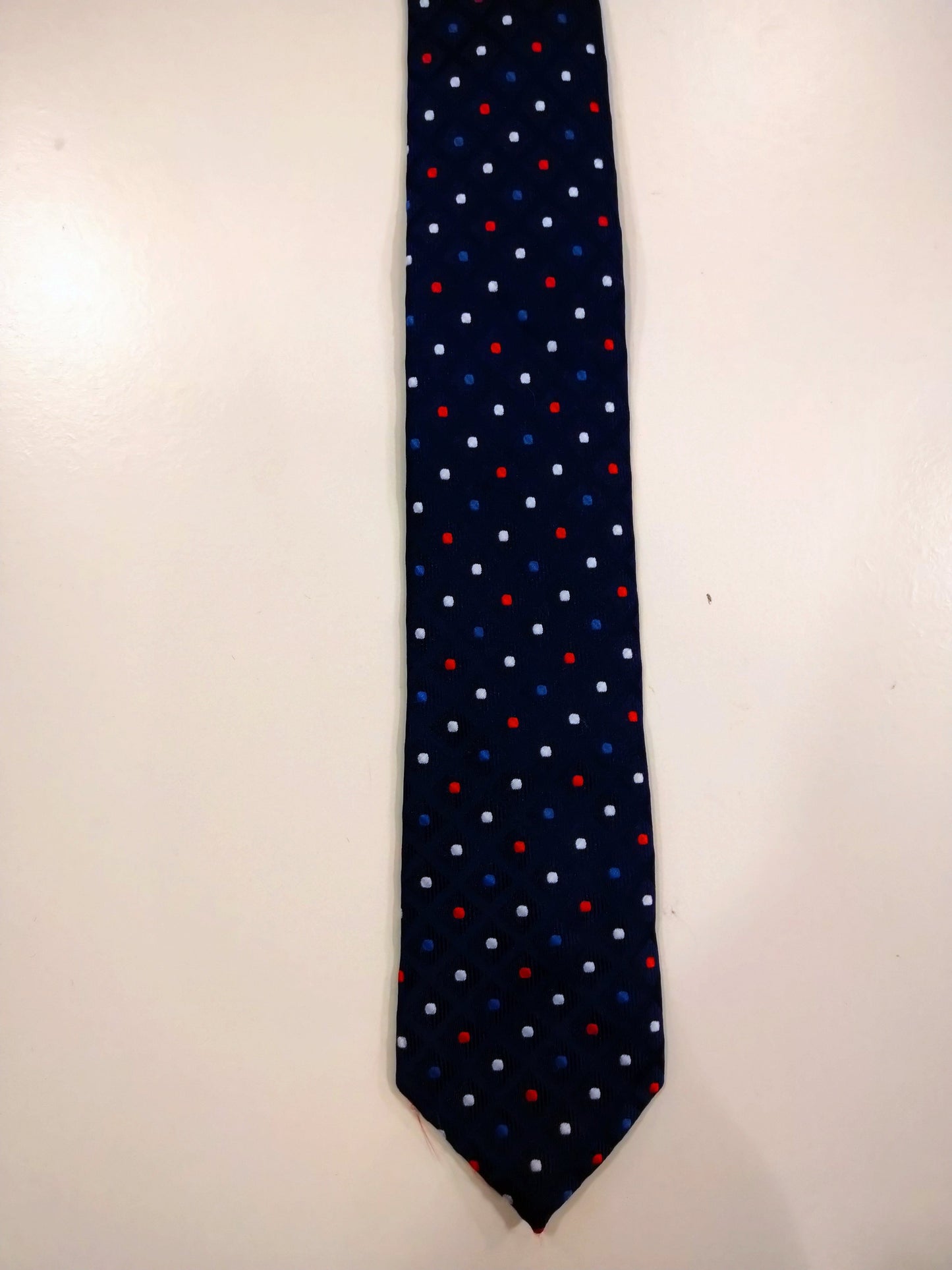 Polyester tie. Blue with balls motif.
