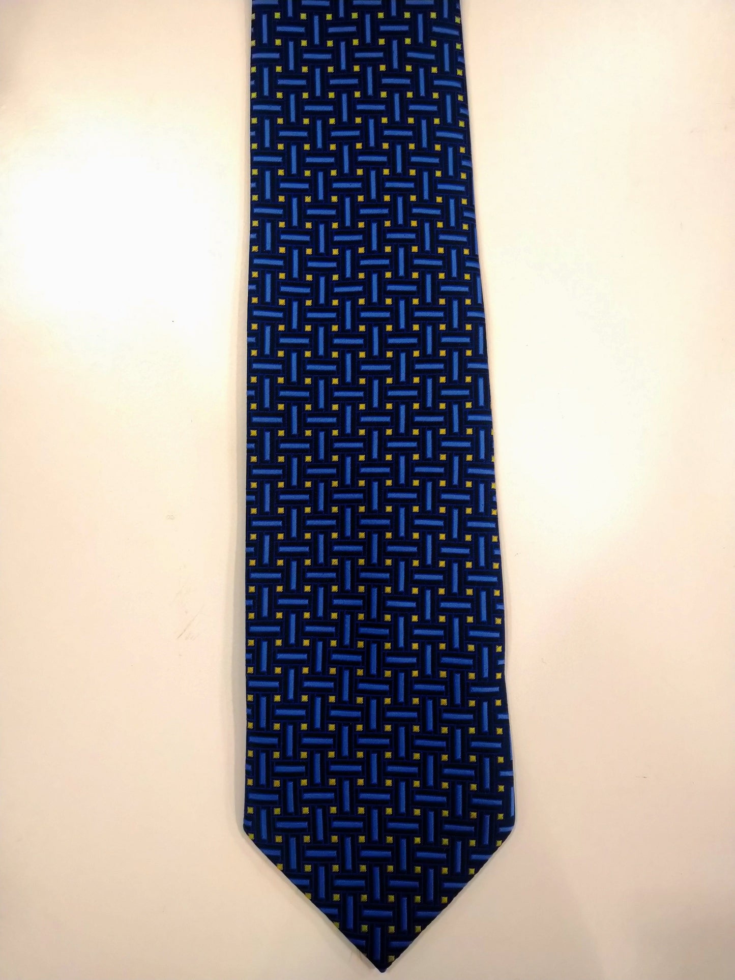 Debenhams polyester stropdas. Blauw geel motief.