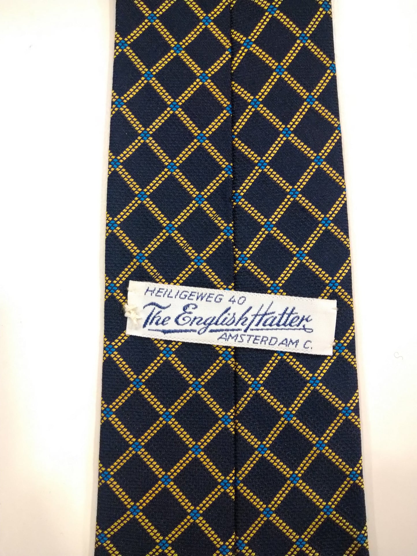 The English Hatter silk tie. Blue yellow motif.