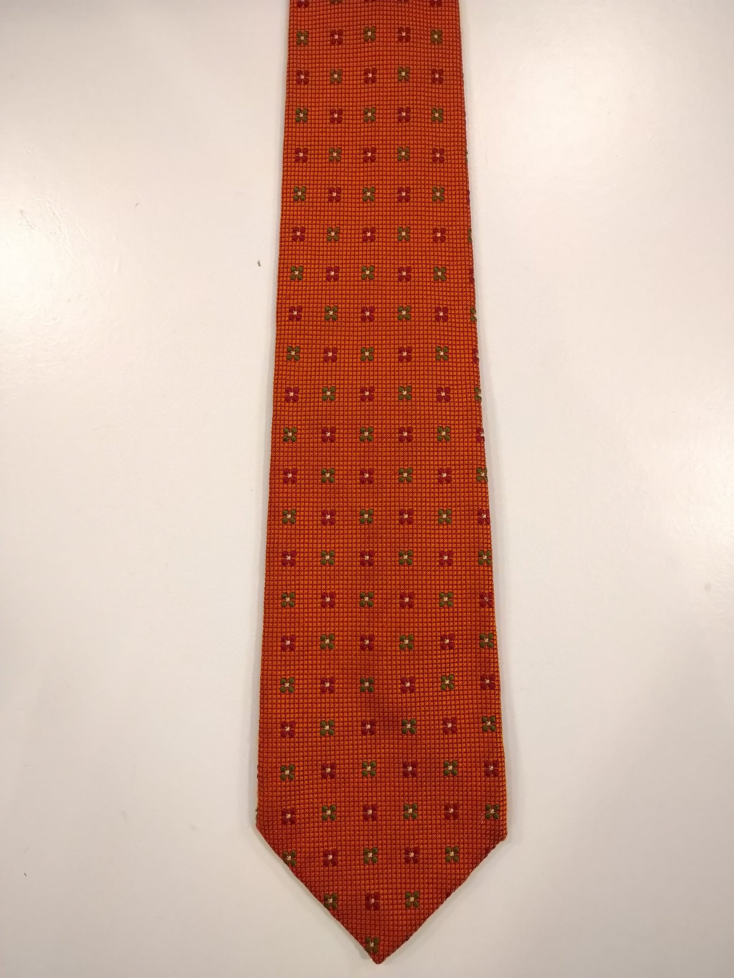 The English Hatter Hand Made Silk Tie. Orange motif.