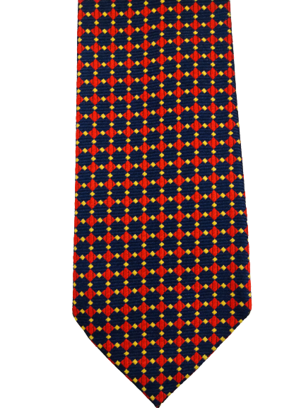 La cravate en soie fabriquée à la main en anglais. Beau motif rouge bleu.