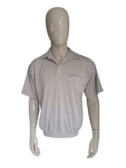 Vintage Humyco Polo with breast pocket and elastic band. Beige colored. Size XXL / 3XL.