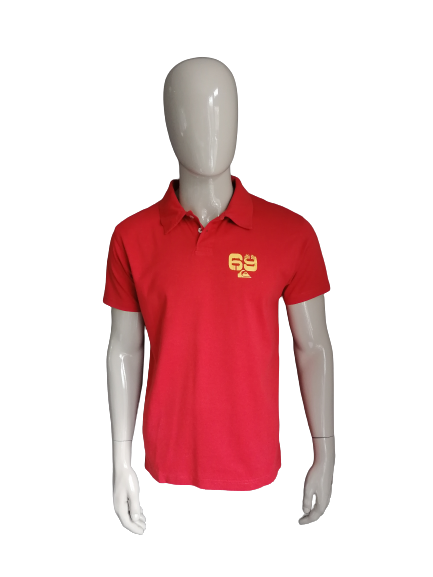 Quiksilver Polo. Red with print front and rear. Size M