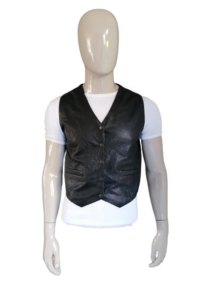 Leather waistcoat with press studs. Colored black. Size M. # 253