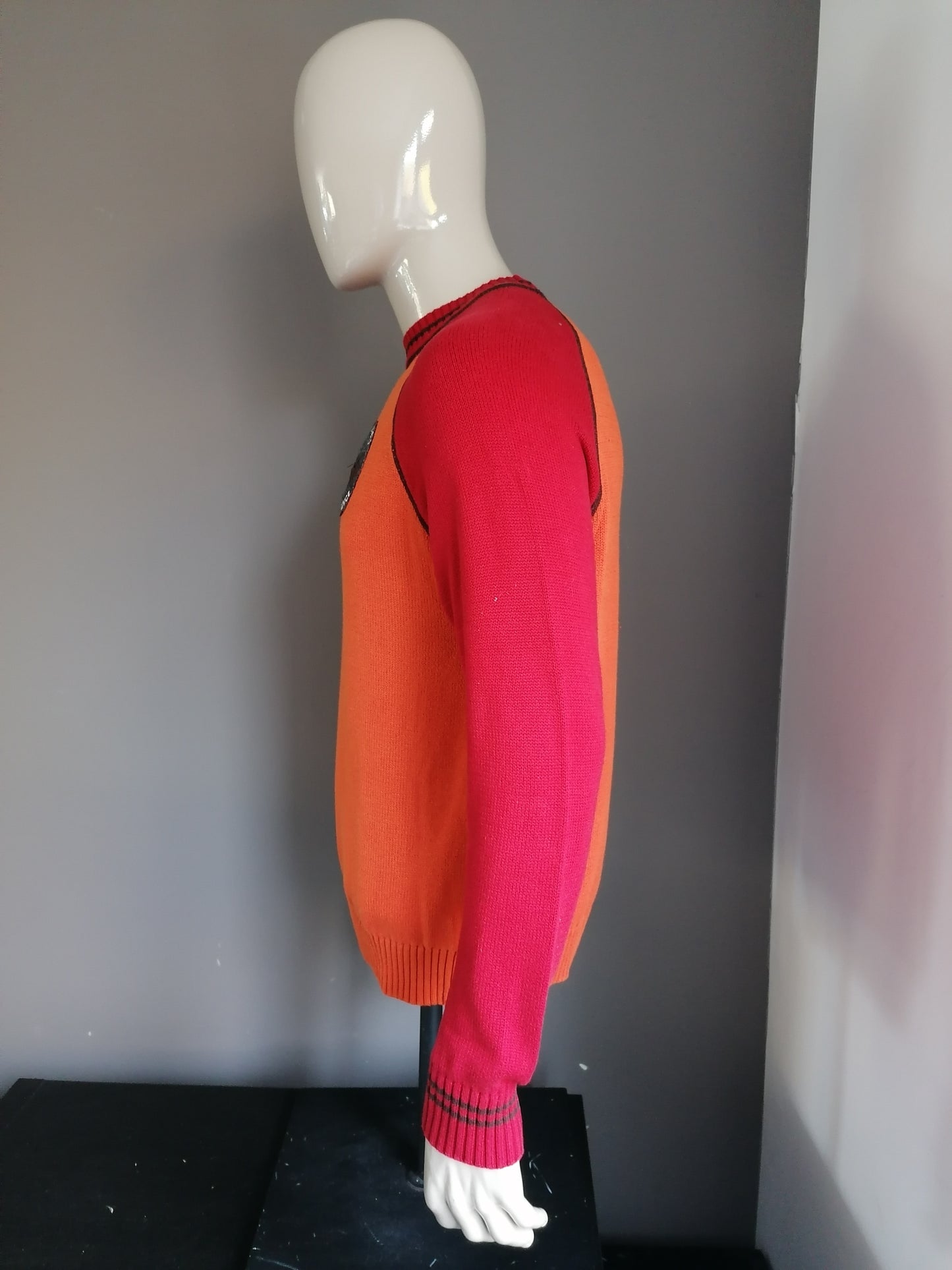 McNeal Sweater. Red colored orange. Size L.